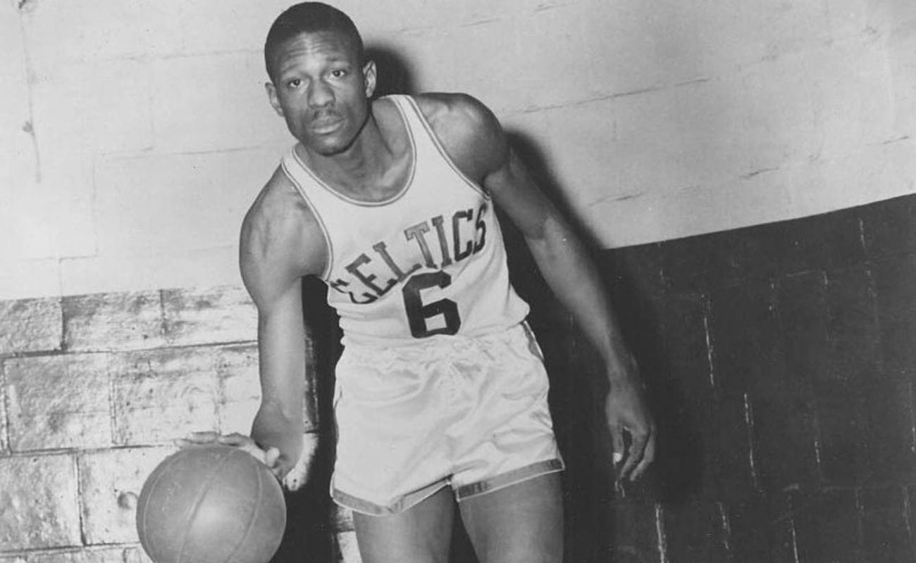  Former Boston Celtics player, Bill Russell dribbling basketball 1960