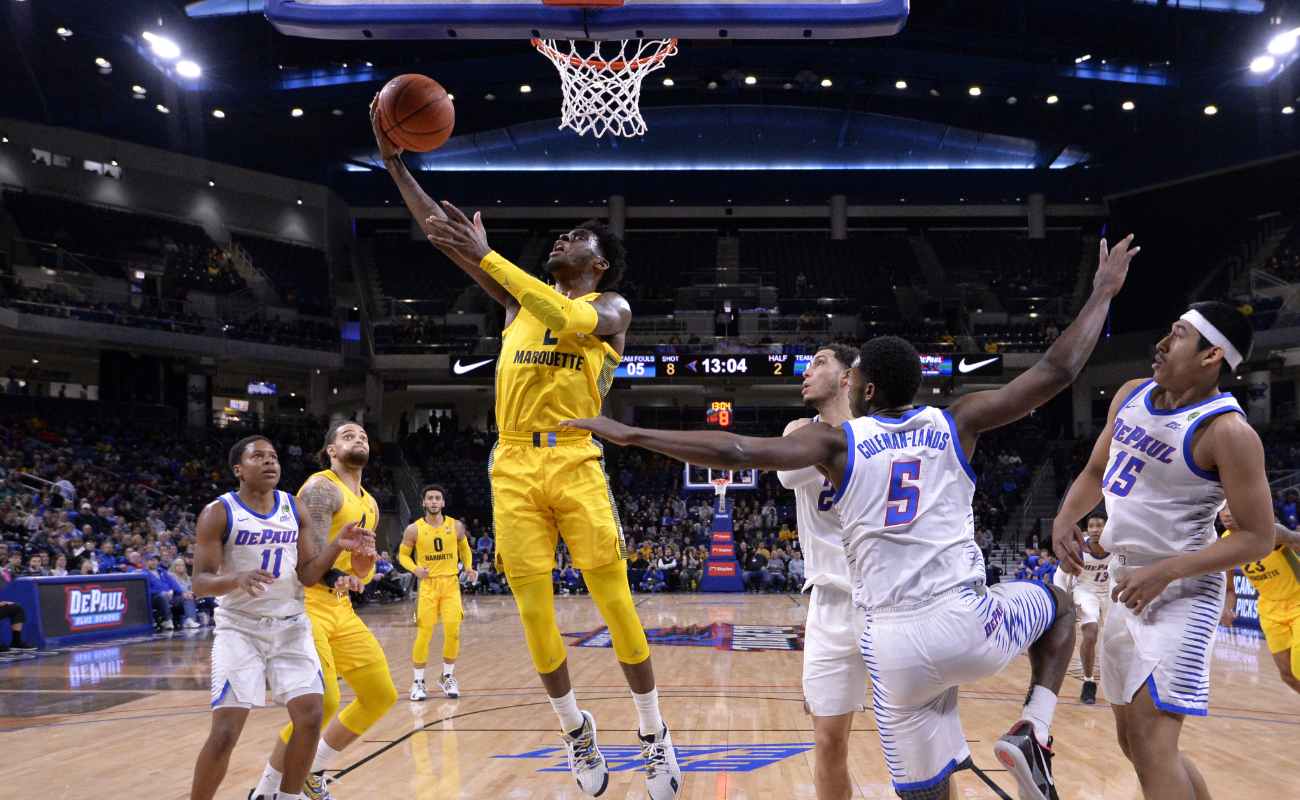 Sacar Anim #2 of the Marquette Golden Eagles shoots i against the DePaul Blue Demons 