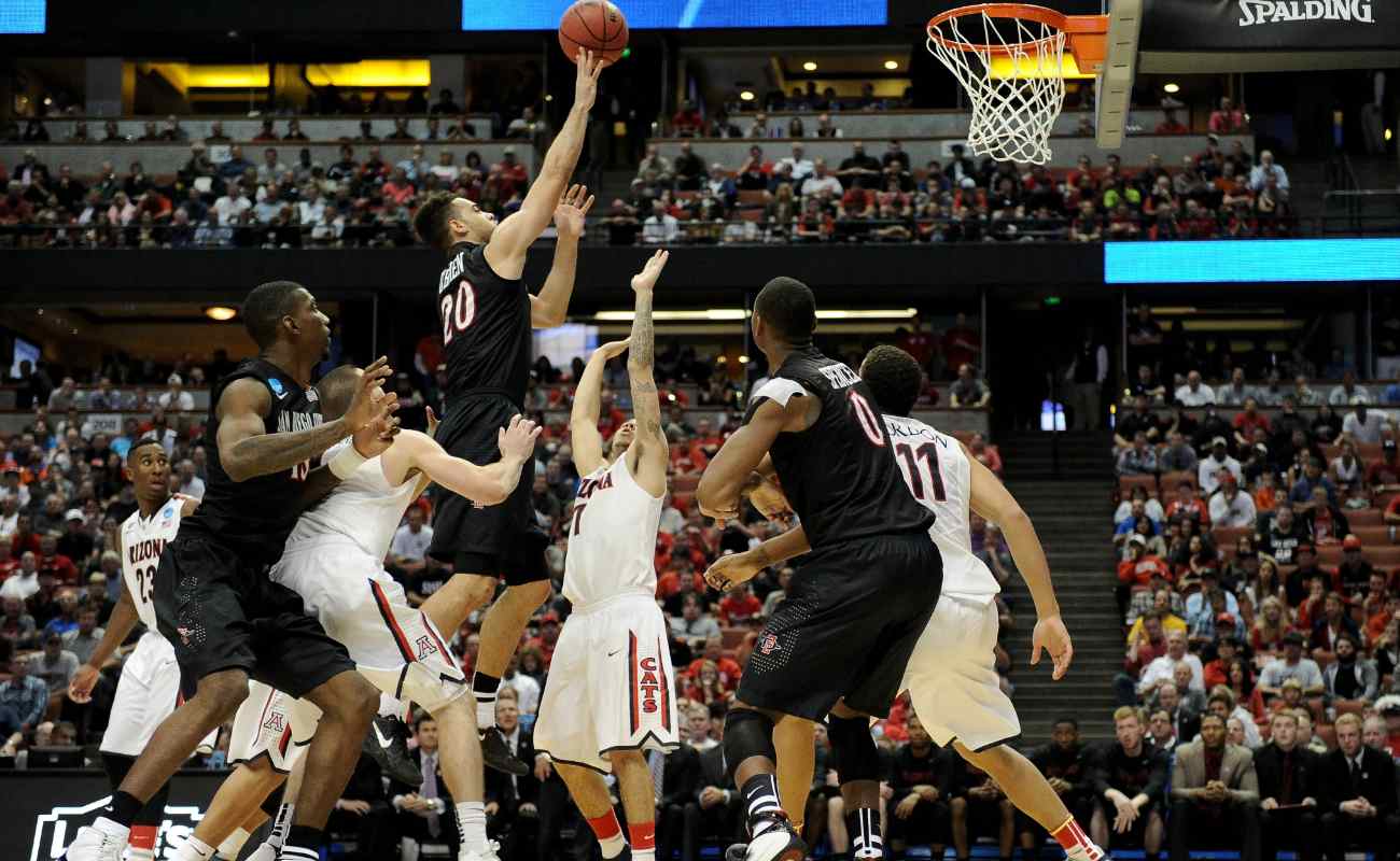 O'Brien of  San Diego State Aztecs shoots over Gabe York of  Arizona Wildcats in regional semifinal of 2014 NCAA Men's Basketball Tournament