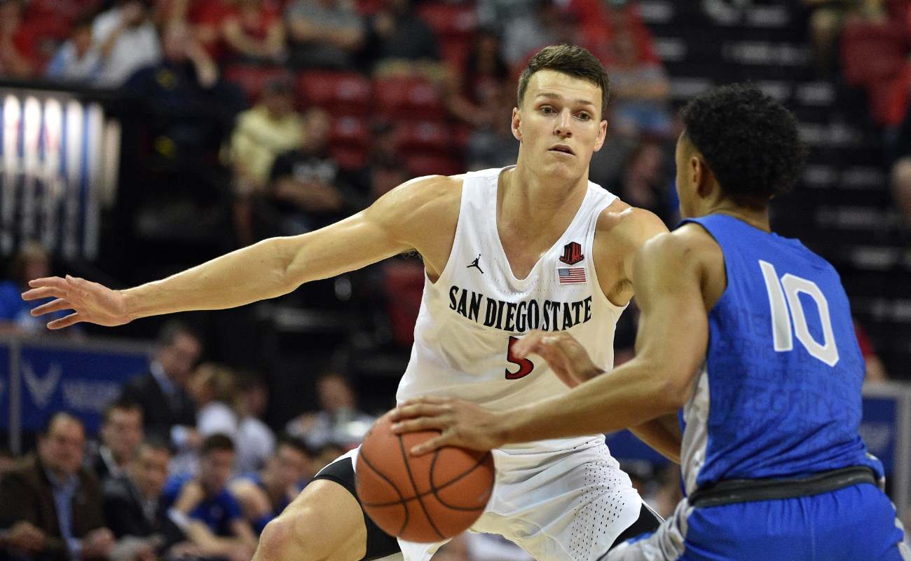 Yanni Wetzell of San Diego State Aztecs defends against A.J. Walker of Air Force Falcons 