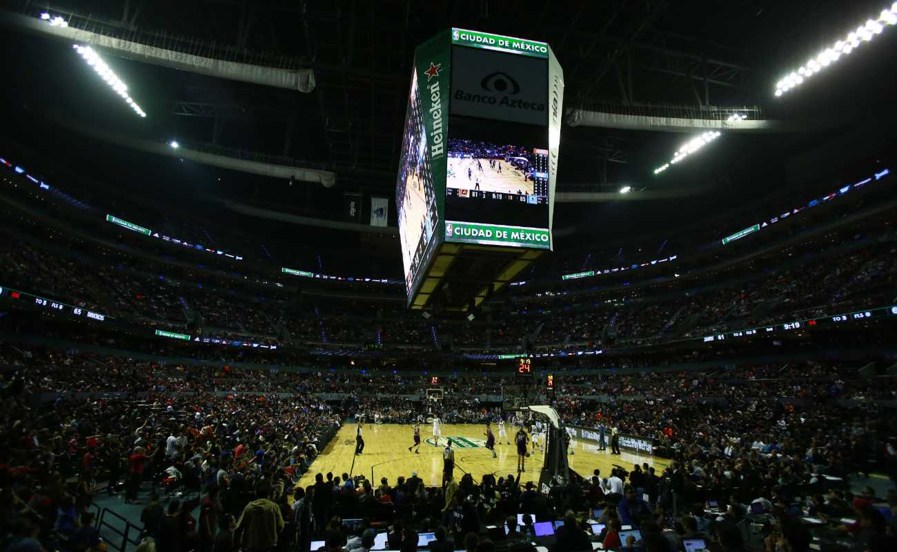 Basketball arena full of fans watching a basketball game