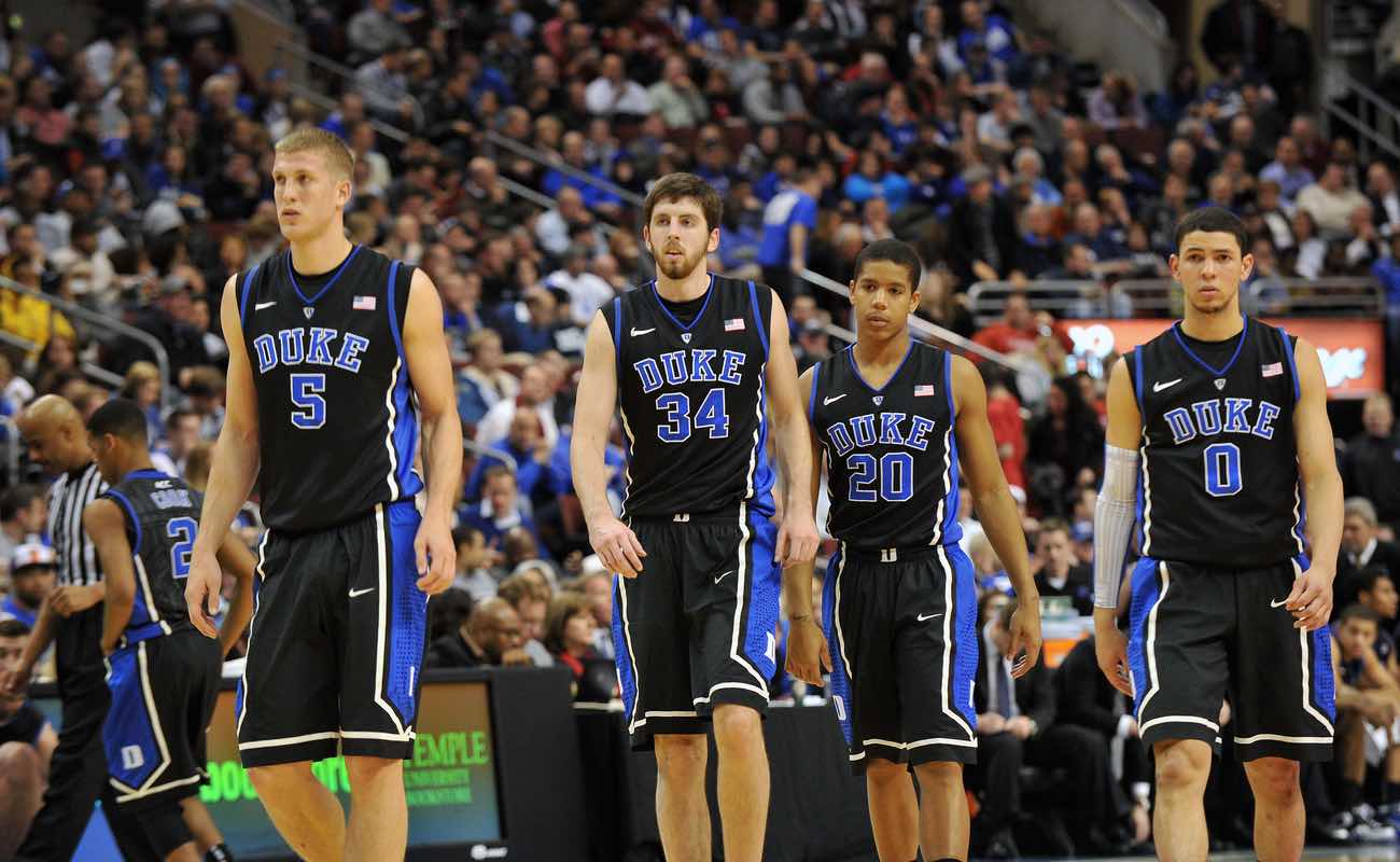 The Duke men's basketball teams heads onto the court following a timeout 