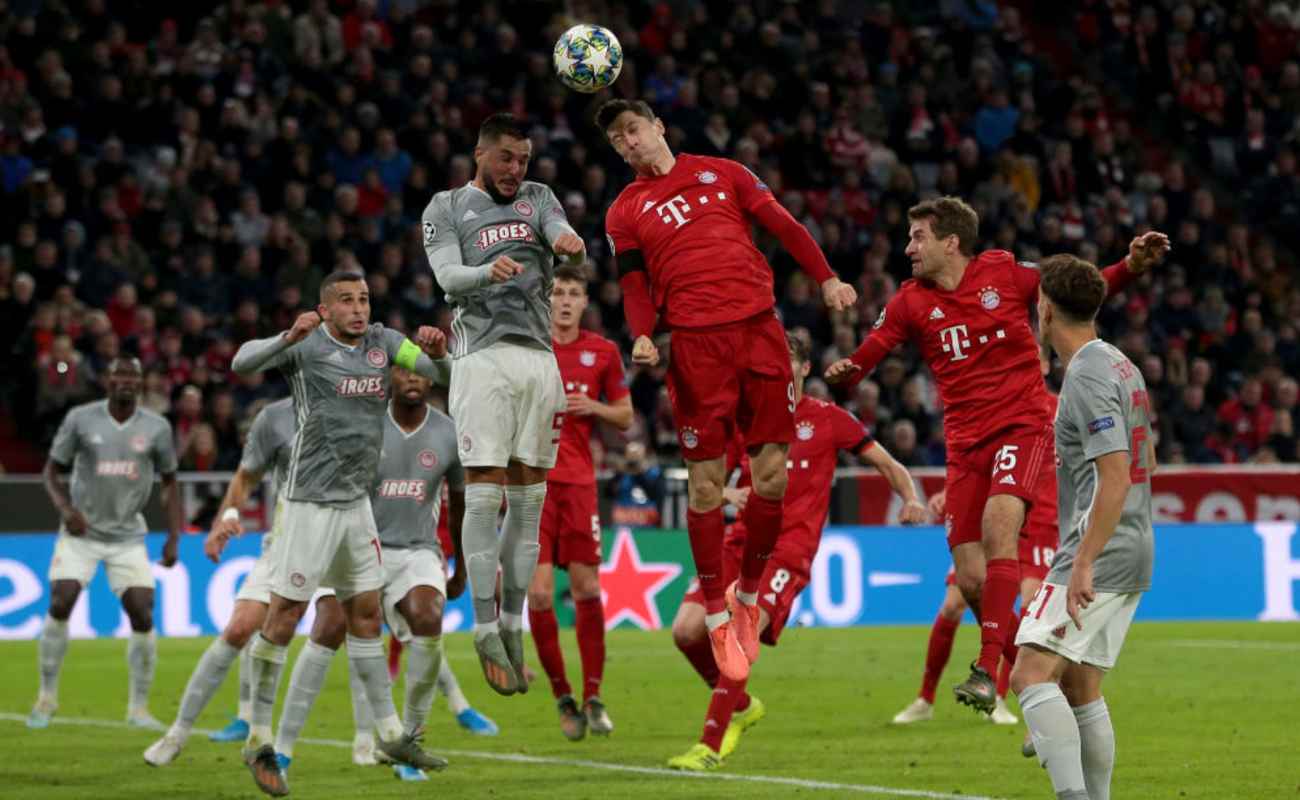 Robert Lewandowski of Bayern Munich Heads the Ball Towards Goal - Photo by TF-Images