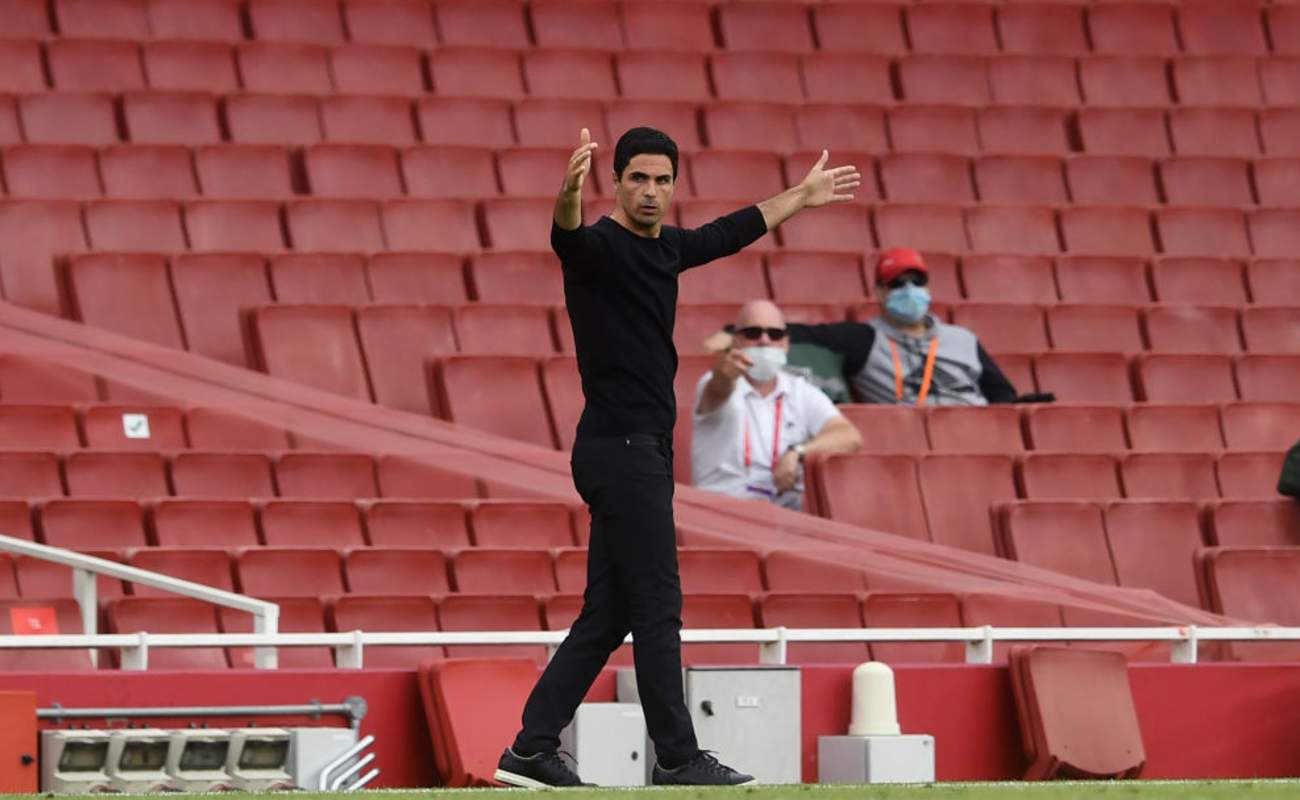 Mikel Arteta Holds His Hands Up in Frustration on the Sideline - Photo by Neil Hall / Getty Images