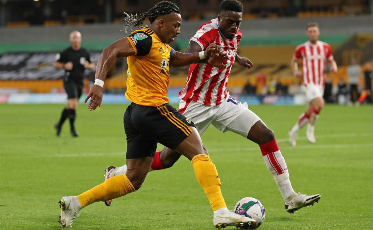 Adama Traore of Wolves moves the ball passed Bruno Martins Indi - Photo by CATHERINE IVILL/POOL/AFP via Getty Images