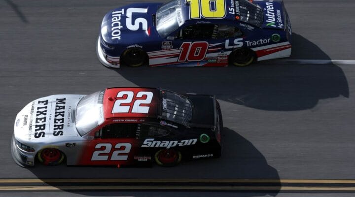 TALLADEGA, ALABAMA - APRIL 24: Austin Cindric, driver of the #22 Snap-On Ford, and Jeb Burton, driver of the #10 LS Tractors Chevrolet, race during the NASCAR Xfinity Series Ag-Pro 300 at Talladega Superspeedway on April 24, 2021 in Talladega, Alabama. (Photo by Sean Gardner/Getty Images)