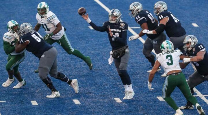 BOISE, ID - DECEMBER 22: Quarterback Carson Strong #12 of the Nevada Wolf Pack passes the ball during second half action against the Tulane Green Wave at the Famous Idaho Potato Bowl at Albertsons Stadium on December 22, 2020 in Boise, Idaho. Nevada won the game 38-27. (Photo by Loren Orr/Getty Images)
