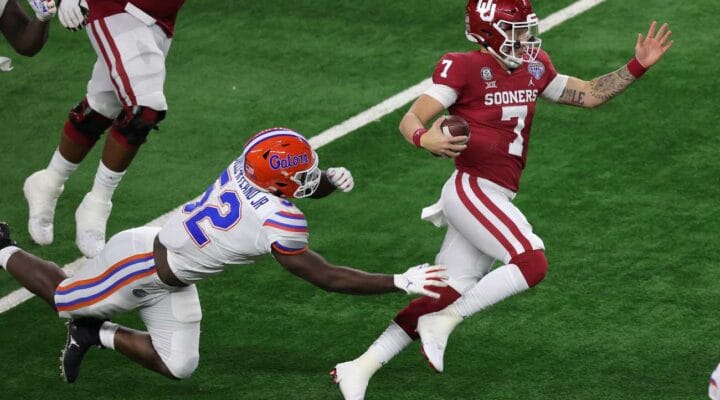 ARLINGTON, TEXAS - DECEMBER 30: Quarterback Spencer Rattler #7 of the Oklahoma Sooners runs against the Florida Gators during the second half at AT&T Stadium on December 30, 2020 in Arlington, Texas. (Photo by Carmen Mandato/Getty Images)