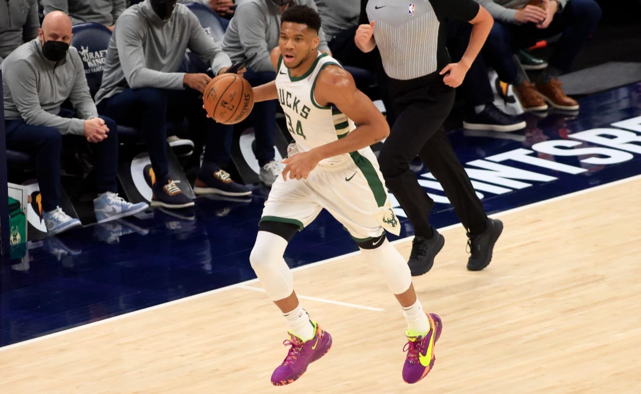 Giannis Antetokounmpo #34 of the Milwaukee Bucks brings the ball up the court in the game against the Indiana Pacers during the first quarter at Bankers Life Fieldhouse on May 13, 2021 in Indianapolis, Indiana.