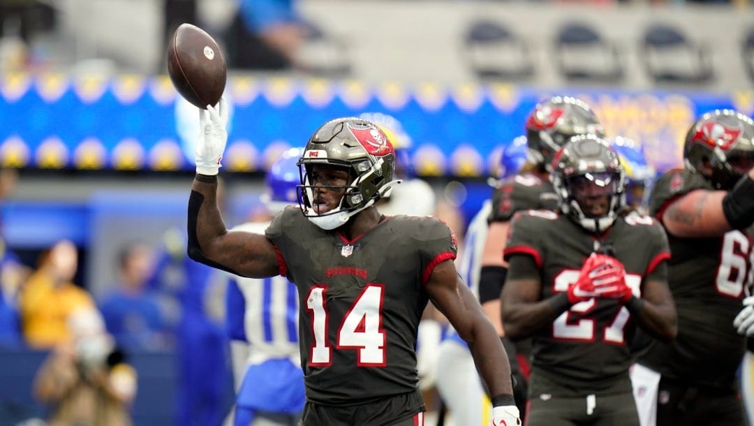 Tampa Bay Buccaneers wide receiver Chris Godwin celebrates after scoring a touchdown during the first half of an NFL football game Sunday, Sept. 26, 2021, in Inglewood, Calif. (AP Photo/Jae C. Hong)