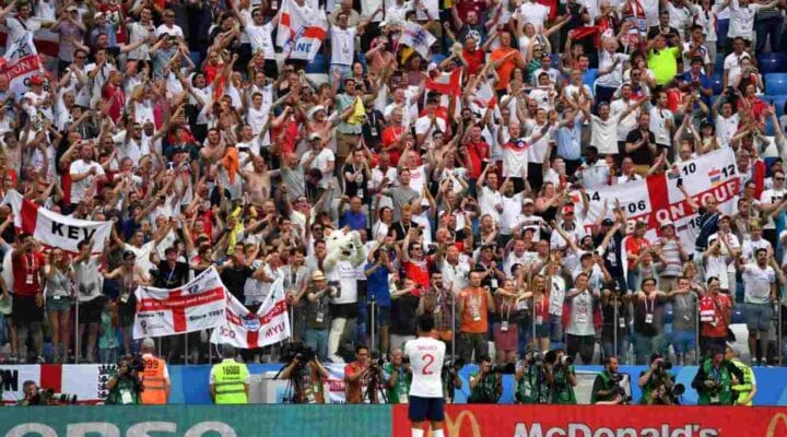 English soccer supporters cheering in the stands - Photo credit should read DIMITAR DILKOFF/AFP via Getty Images