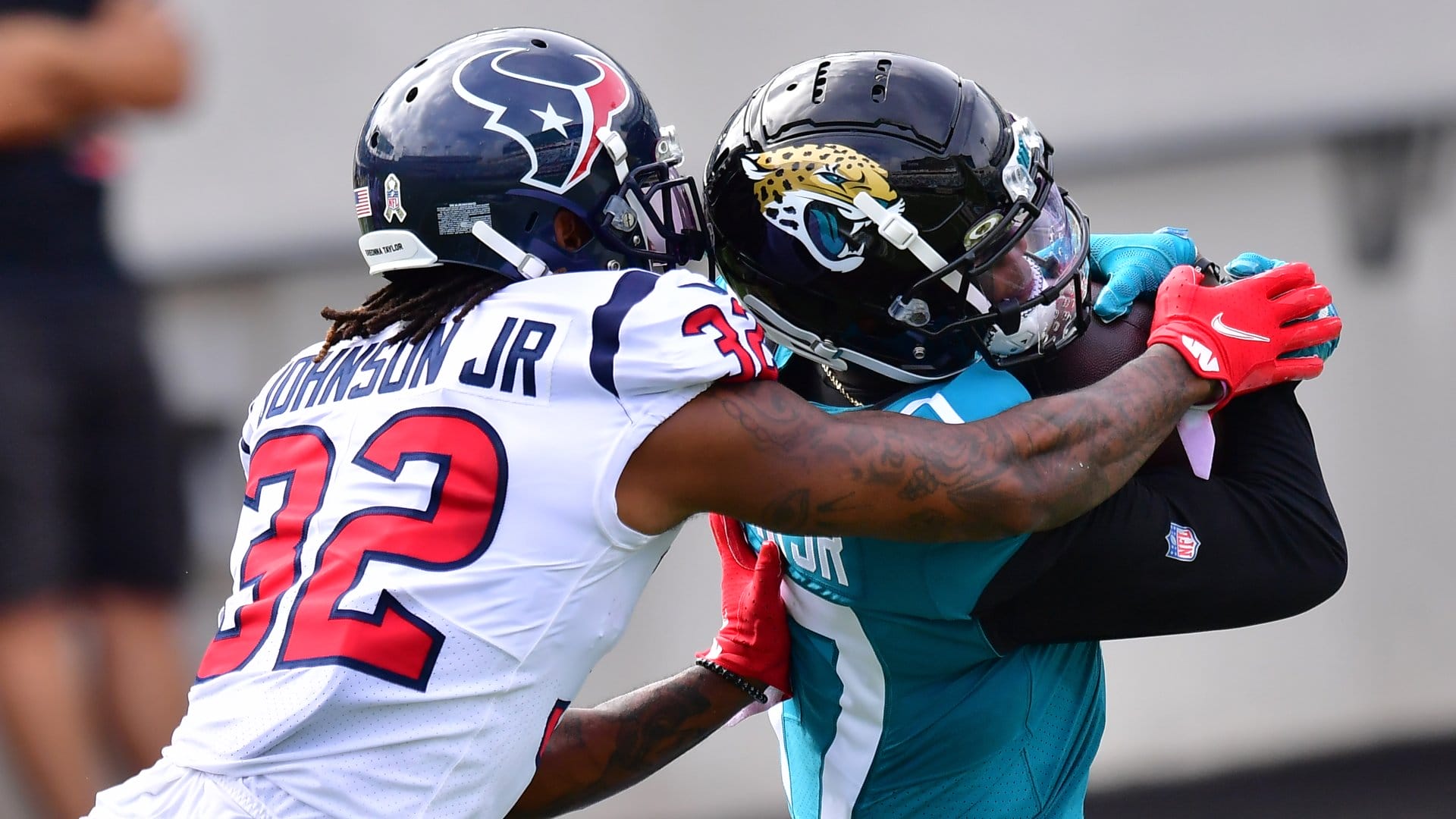 JACKSONVILLE, FLORIDA - NOVEMBER 08: D.J. Chark #17 of the Jacksonville Jaguars scores a touchdown in front of Lonnie Johnson #32 of the Houston Texans during the first quarter of a game at TIAA Bank Field on November 08, 2020 in Jacksonville, Florida. (Photo by Julio Aguilar/Getty Images)
