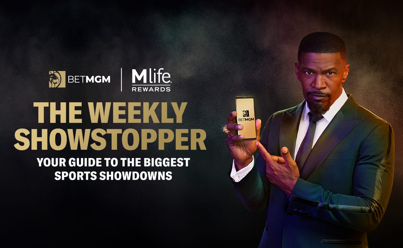 Actor and BetMGM Brand Ambassador Jamie Foxx with a phone in his right hand on a dark background