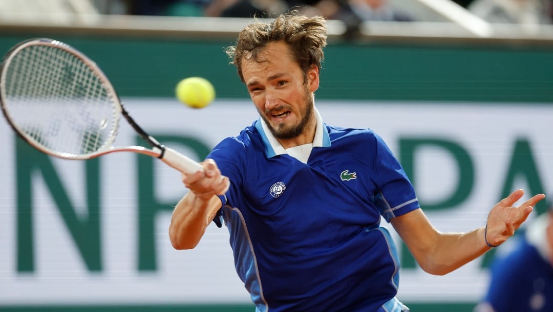 Russia's Daniil Medvedev returns the ball to Croatia's Marin Cilic during their fourth round match of the French Open tennis tournament at the Roland Garros stadium Monday, May 30, 2022 in Paris.
