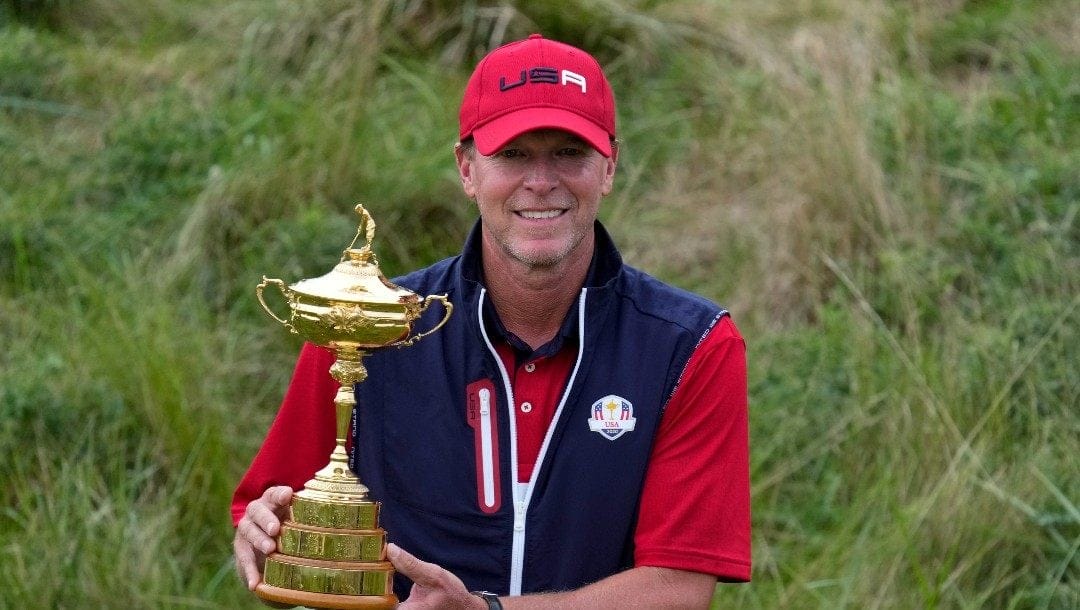 Team USA captain Steve Stricker poses with the trophy after the Ryder Cup matches at the Whistling Straits Golf Course, Sunday, Sept. 26, 2021