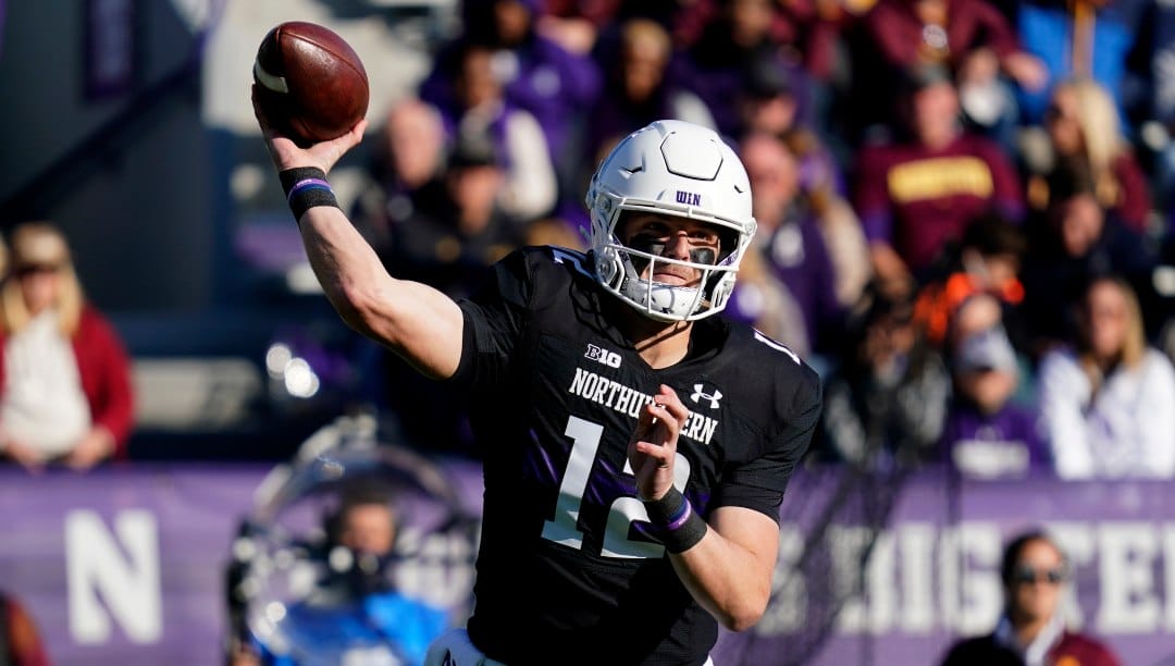 Northwestern quarterback Ryan Hilinski throws a pass during the first half of an NCAA college football game against Minnesota in Evanston, Ill., Saturday, Oct. 30, 2021.