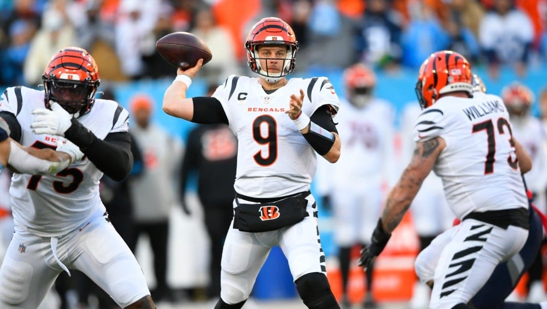 Cincinnati Bengals quarterback Joe Burrow (9) pases from the pocket against the Tennessee Titans during the first half of an NFL divisional round playoff football game, Saturday, Jan. 22, 2022, in Nashville, Tenn. (AP Photo/John Amis)