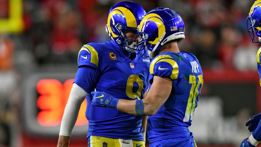 Los Angeles Rams quarterback Matthew Stafford (9) celebrates with wide receiver Cooper Kupp (10) after his reception against the Tampa Bay Buccaneers during the second half of an NFL divisional round playoff football game Sunday, Jan. 23, 2022, in Tampa, Fla. (AP Photo/Jason Behnken)