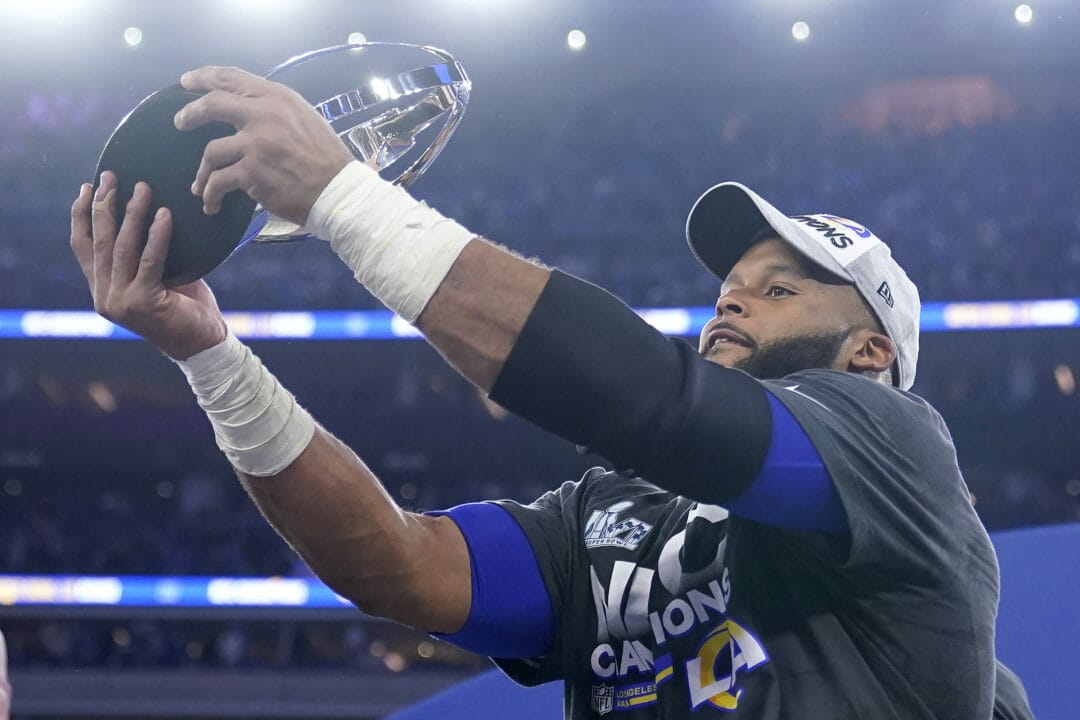 The Los Angeles Rams' Aaron Donald holds the George Halas trophy after the NFC Championship