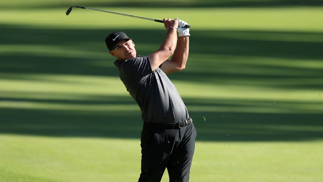 Brooks Koepka hits his second shot on the 13th hole during the second round of the Genesis Invitational in 2022.