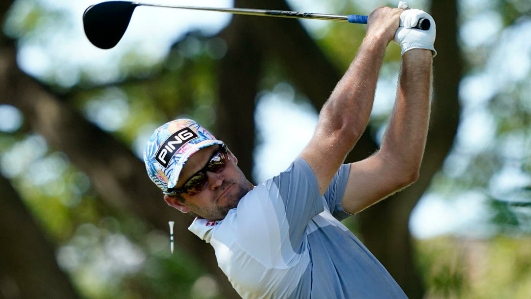 Corey Conners, of Canada, plays his shot from the second tee during the third round of the Sony Open golf tournament.