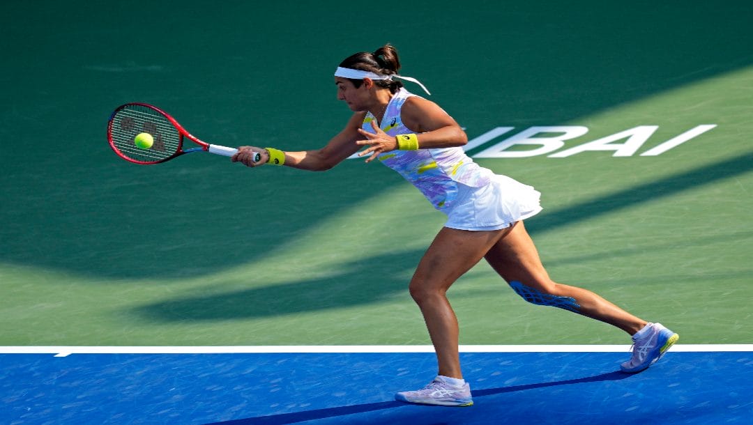 Caroline Garcia of France returns the ball to Barbora Krejcikova of the Czech Republic during a match of the Dubai Duty Free Tennis Championship