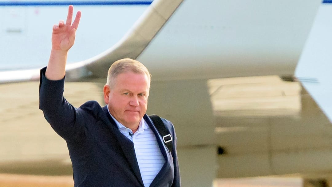 Former Notre Dame head football coach Brian Kelly arrives after being hired as LSU head coach in Baton Rouge, La., Tuesday, Nov. 30, 2021. (AP Photo/Matthew Hinton)