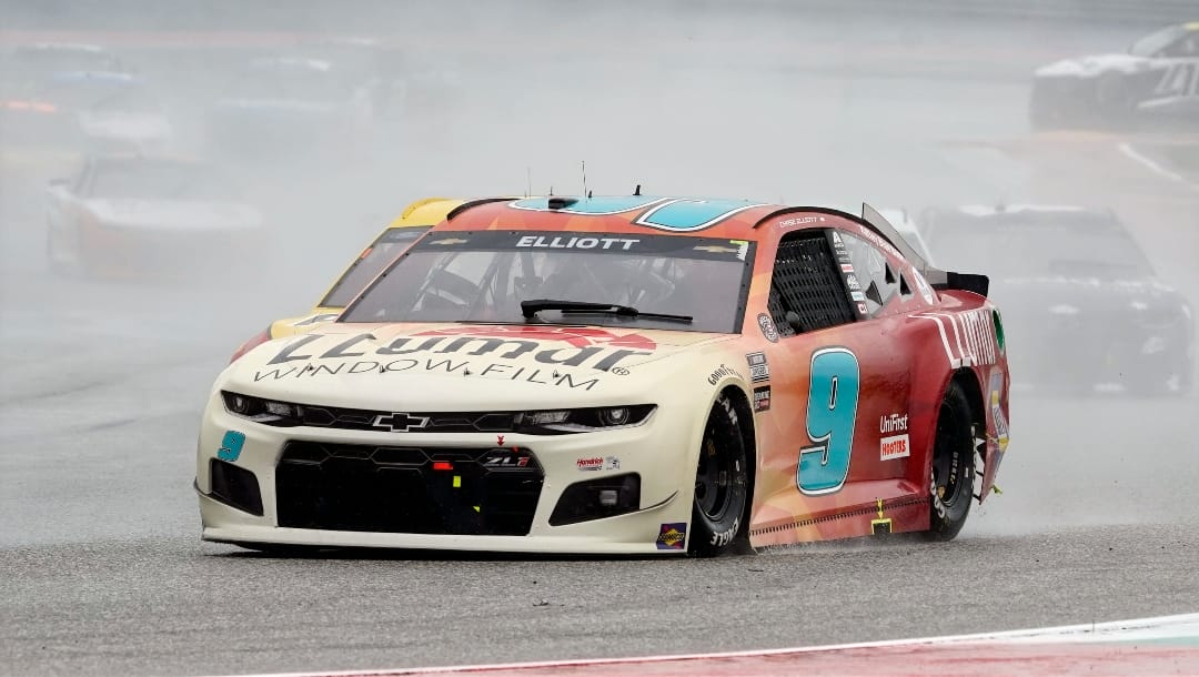 Chase Elliott (9) leads cars into Turn 13 during a NASCAR Cup Series auto race at Circuit of the Americas in Austin, Texas, Sunday, May 23, 2021. (AP Photo/Chuck Burton)