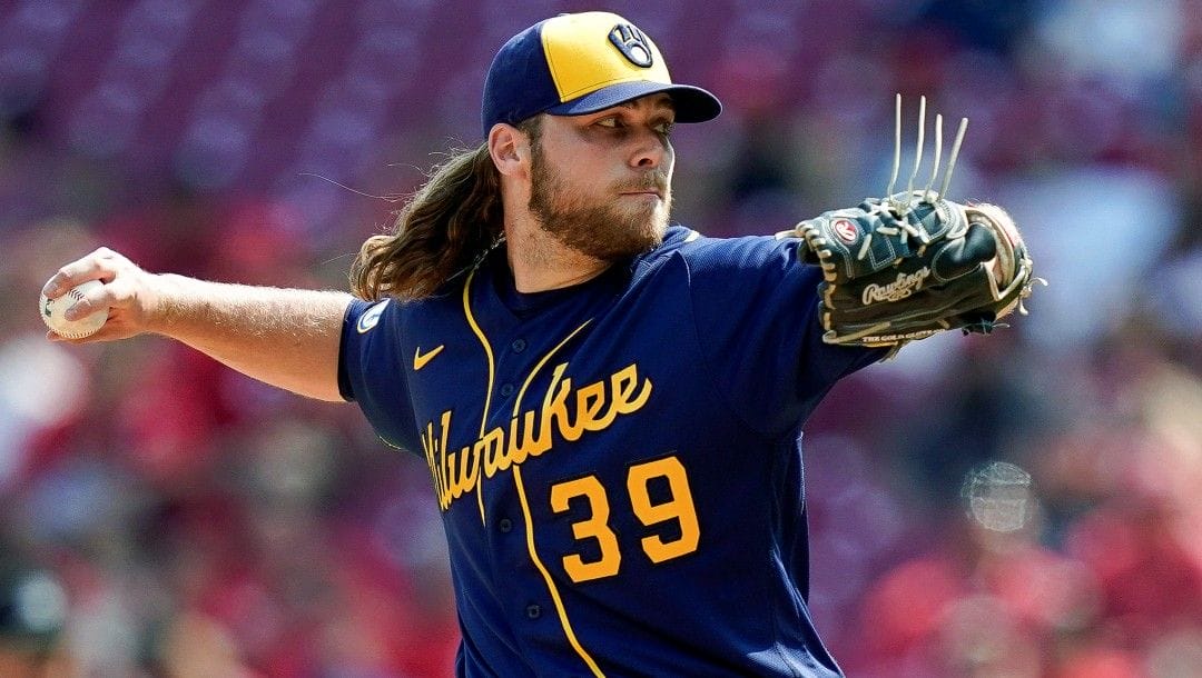 Milwaukee Brewers starting pitcher Corbin Burnes throws during the ninth inning of the team's baseball game against the Cincinnati Reds in Cincinnati, on July 18, 2021. Burnes faces a major challenge trying to improve upon a spectacular 2021 season that earned him the NL Cy Young Award.
