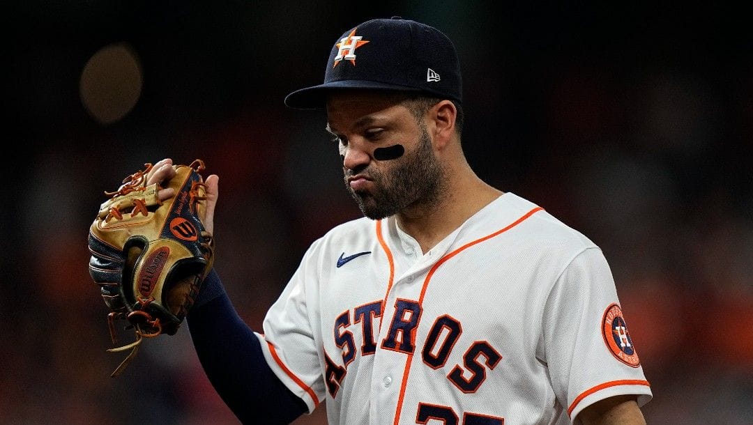Houston Astros second baseman Jose Altuve walks to the dugout during the seventh inning in Game 6 of baseball's World Series between the Houston Astros and the Atlanta Braves Tuesday, Nov. 2, 2021, in Houston.