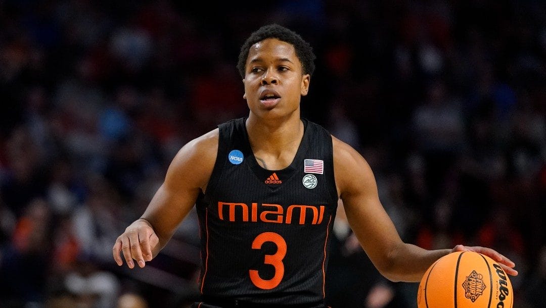 Miami guard Charlie Moore plays against Auburn during the first half of a college basketball game in the second round of the NCAA tournament on Sunday, March 20, 2022, in Greenville, S.C.