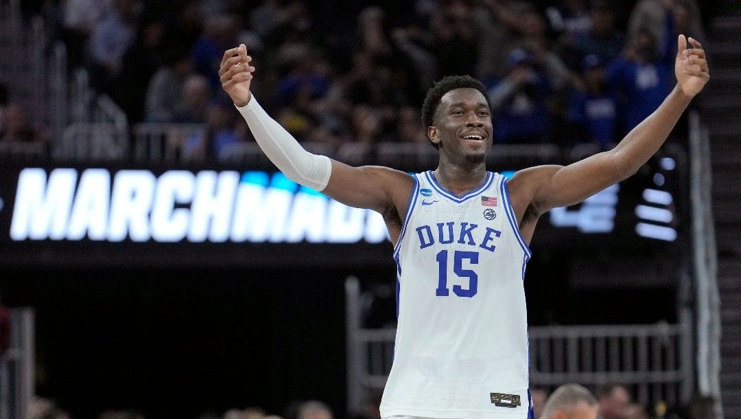 Duke center Mark Williams (15) celebrates after his team defeated Arkansas in a college basketball game in the Elite 8 round of the NCAA men's tournament in San Francisco, Saturday, March 26, 2022.