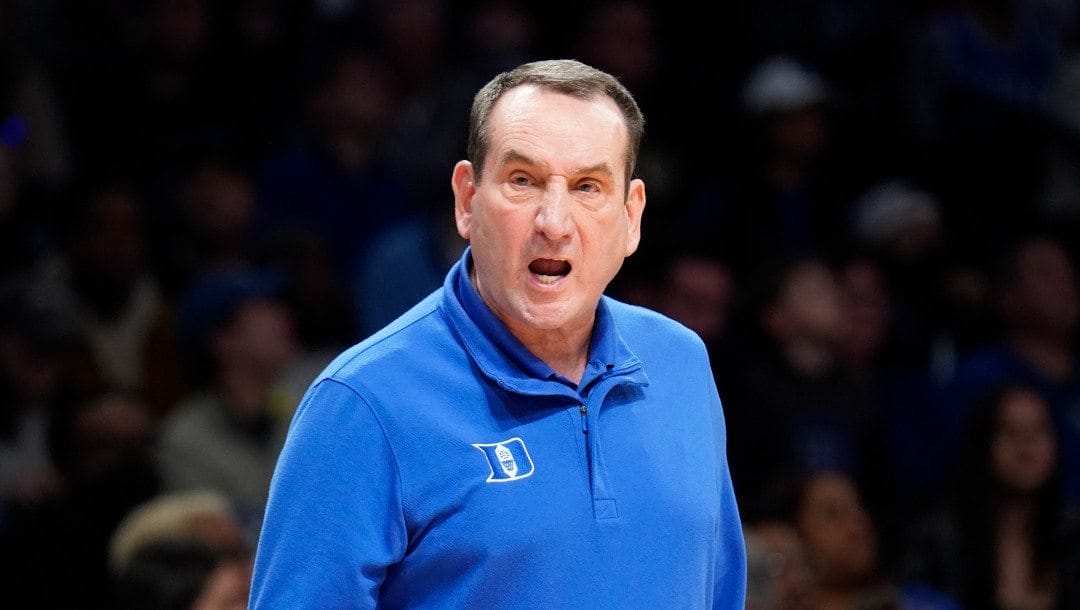 Duke head coach Mike Krzyzewski works the bench in the first half of an NCAA college basketball game against Miami during semifinals of the Atlantic Coast Conference men's tournament.