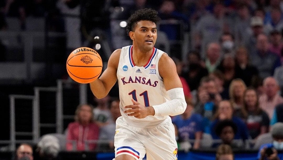Kansas guard Remy Martin handles the ball during a second-round game against Creighton in the NCAA college basketball tournament in Fort Worth, Texas, Saturday, March, 19, 2022.