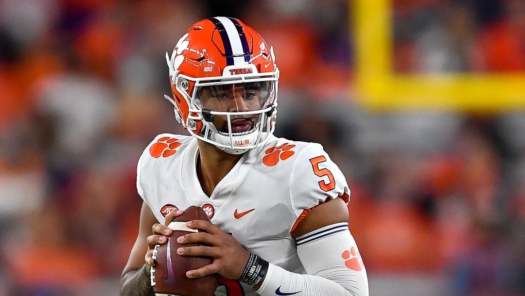 Clemson quarterback DJ Uiagalelei looks to pass during the first half of an NCAA college football game against Syracuse in Syracuse, N.Y., Friday, Oct. 15, 2021. Clemson coach Dabo Swinney won't let all the questions about changes on the Tigers ruin his excitement to get back on the field.
