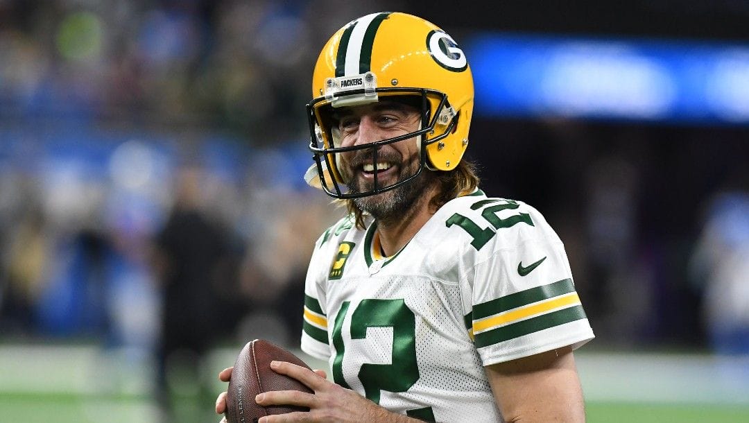 Green Bay Packers quarterback Aaron Rodgers smiles during pregame of an NFL football game against the Detroit Lions, Sunday, Jan. 9, 2022.