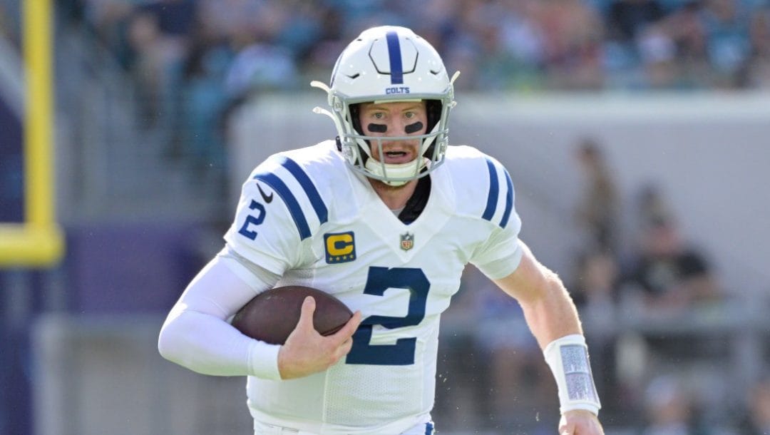 Indianapolis Colts quarterback Carson Wentz (2) scrambles for yardage during the first half of an NFL football game against the Jacksonville Jaguars.