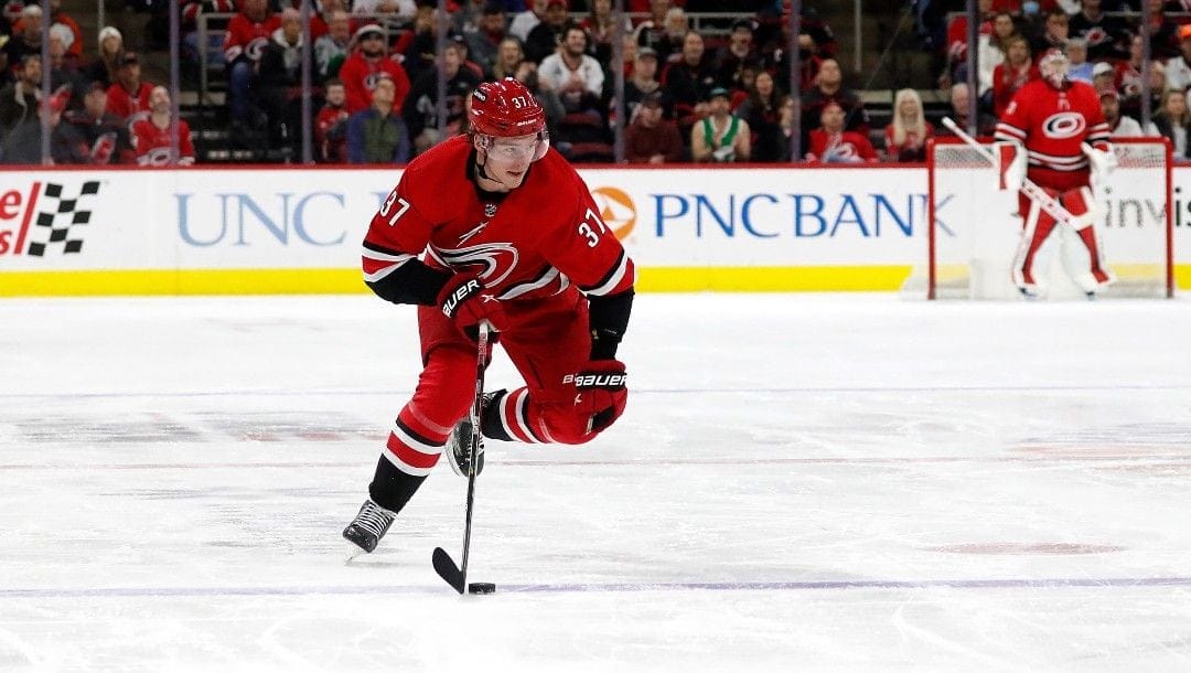 Carolina Hurricanes' Andrei Svechnikov (37) moves the puck against the Philadelphia Flyers during the second period of an NHL hockey game in Raleigh, N.C., Saturday, March 12, 2022.