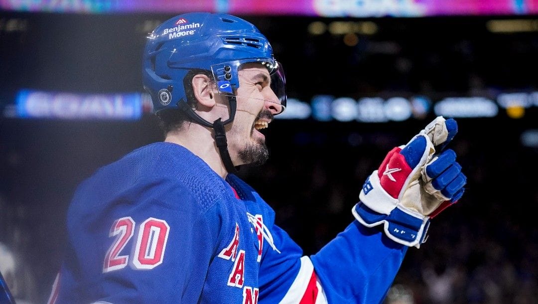 New York Rangers left wing Chris Kreider (20) reacts after scoring his second goal of the game on Pittsburgh Penguins goaltender Tristan Jarry (35) during the second period of an NHL hockey game, Friday, March 25, 2022, in New York.