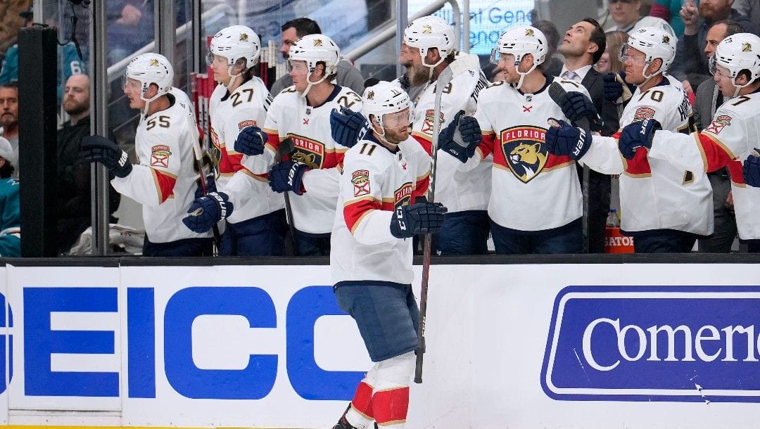 Florida Panthers left wing Jonathan Huberdeau (11) is congratulated by teammates after his goal against the San Jose Sharks during the first period of an NHL hockey game in San Jose, Calif., Tuesday, March 15, 2022.