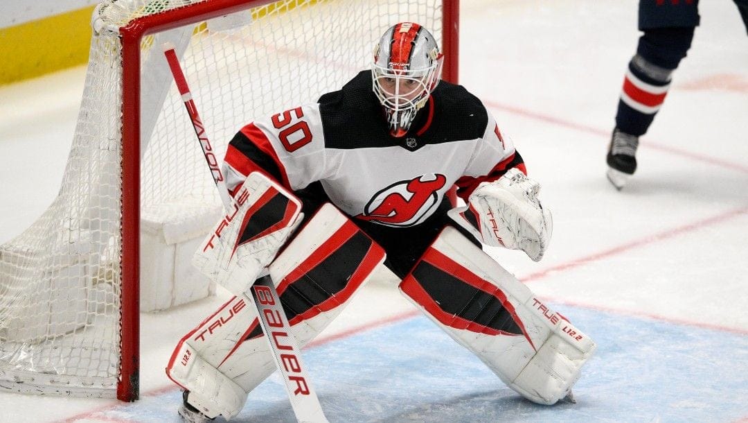 New Jersey Devils goaltender Nico Daws (50) in action during the third period of an NHL hockey game against the Washington Capitals, Saturday, March 26, 2022, in Washington. The Capitals won 4-3.