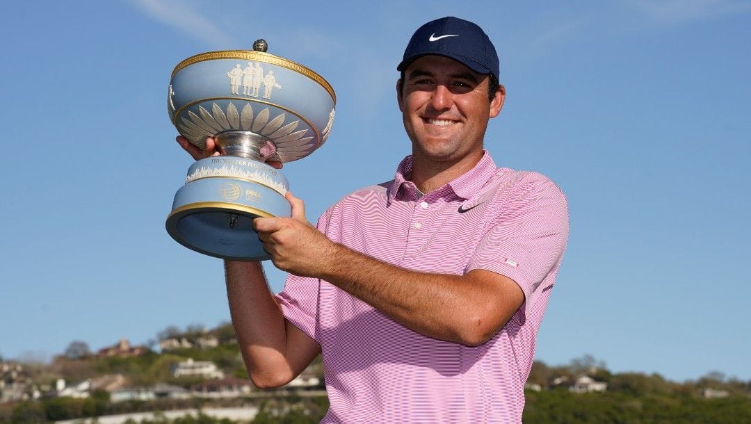 Scottie Scheffler holds the trophy after winning the Dell Technologies Match Play Championship golf tournament, Sunday, March 27, 2022, in Austin, Texas.