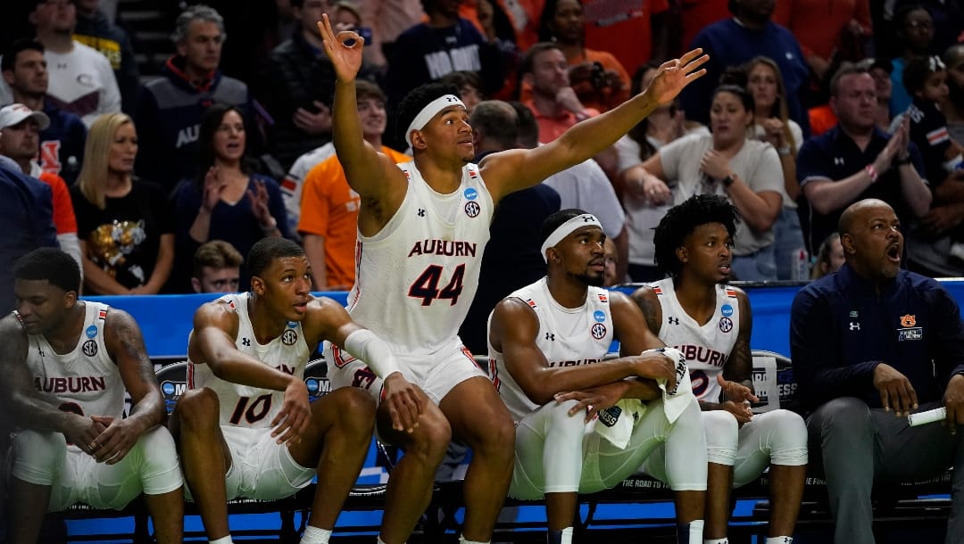 Auburn center Dylan Cardwell (44) celebrates during the second half of a college basketball game against Jacksonville State in the first round of the NCAA tournament on Friday, March 18, 2022, in Greenville, S.C. (AP Photo/Chris Carlson)