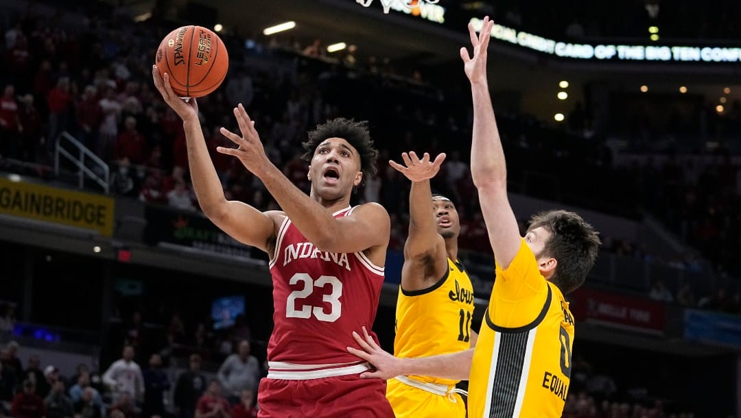 Indiana's Trayce Jackson-Davis (23) shoots against dIowa's Filip Rebraca (0) during the first half of an NCAA college basketball game in the semifinal round at the Big Ten Conference tournament.