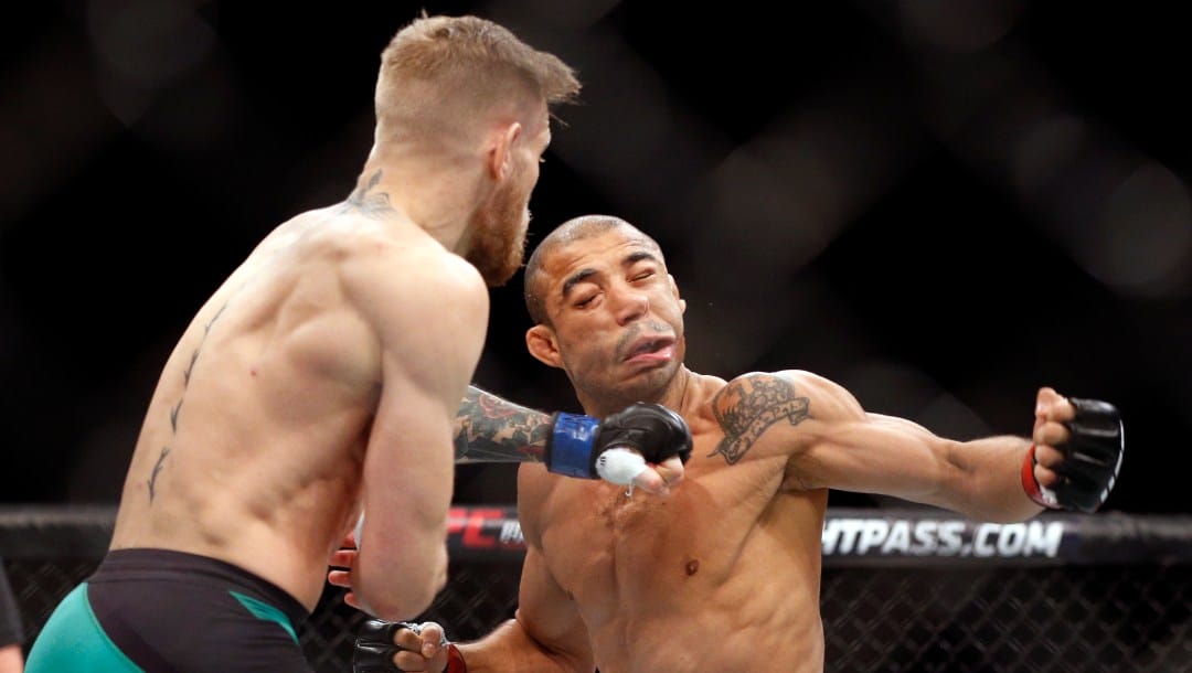 In this Dec. 12, 2015, file photo, Conor McGregor, left, fights Jose Aldo during a featherweight championship mixed martial arts bout at UFC 194 in Las Vegas.