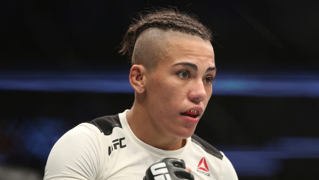 Jessica Andrade fights Joanna Jędrzejczyk in a mixed martial arts bout at UFC 211 for the UFC Women's strawweight championship, Saturday, May 13, 2017, in Dallas. Jedrzejczyk retained her title via unanimous decision. (AP Photo/Gregory Payan)
