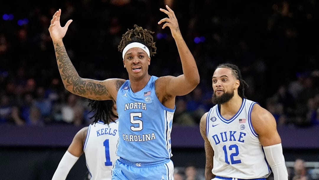 North Carolina's Armando Bacot (5) reacts to a play during the first half of a college basketball game against Duke in the semifinal round of the Men's Final Four NCAA tournament, Saturday, April 2, 2022, in New Orleans. (AP Photo/Brynn Anderson)