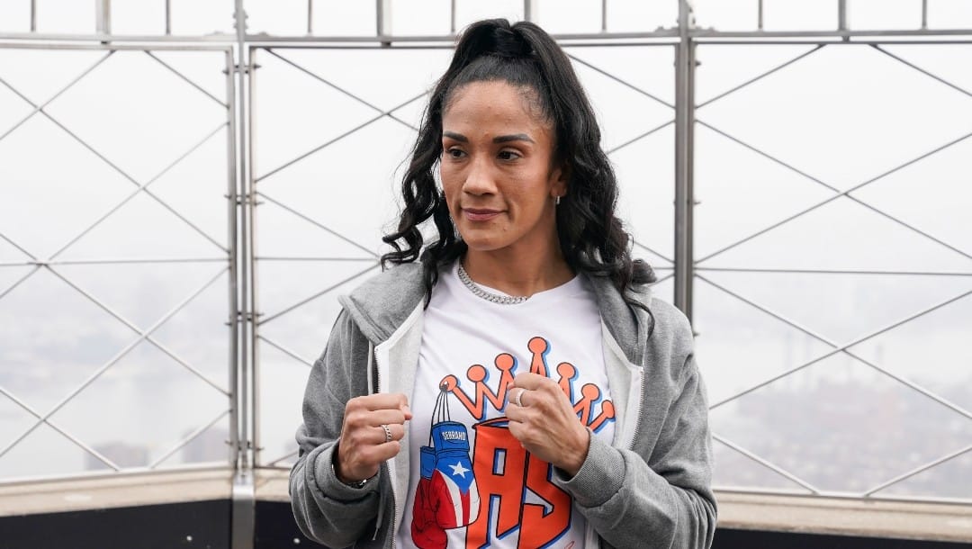 Boxer Amanda Serrano poses for a picture on the observation deck of the Empire State Building in New York, Tuesday, April 26, 2022. Serrano and Katie Taylor will become the first two female fighters to headline a boxing match at Madison Square Garden when they fight on Saturday for the World Lightweight title.