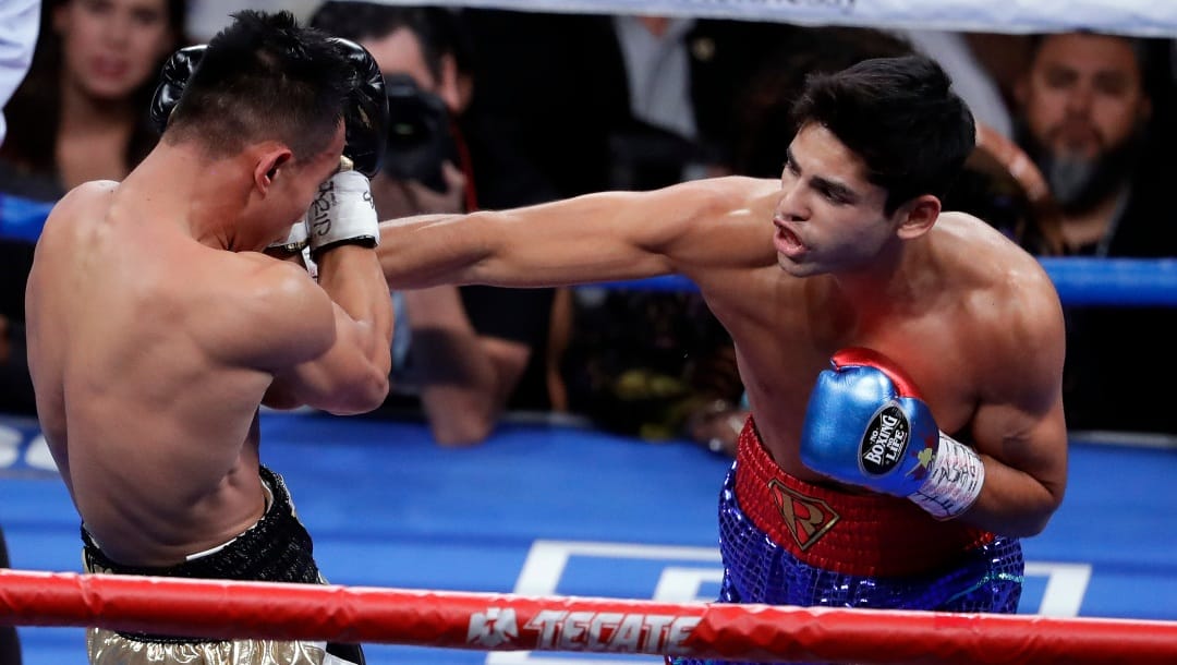 Ryan Garcia, right, punches Romero Duno during their lightweight boxing match Saturday, Nov. 2, 2019, in Las Vegas.