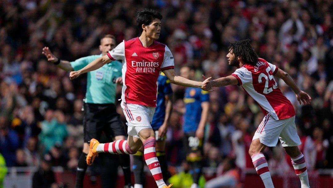 Arsenal's Takehiro Tomiyasu runs onto the field after coming on as substitute during an English Premier League soccer match between Arsenal and Manchester United at the Emirates stadium in London, Saturday April 23, 2022.